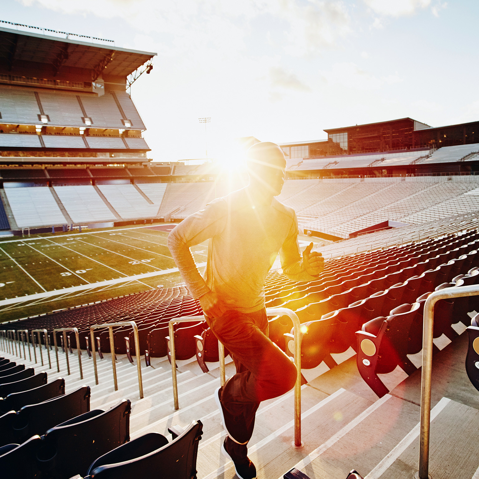Man running in stadium